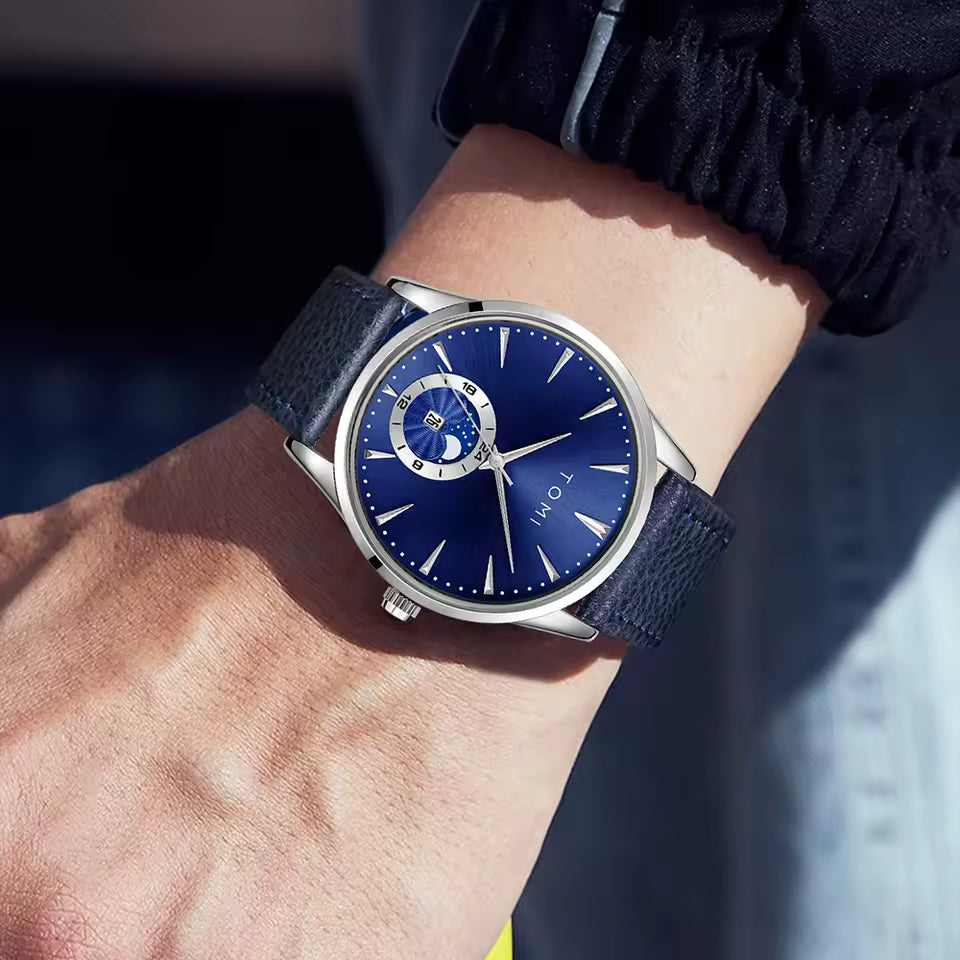 Blue wristwatch with a detailed face on a person's wrist