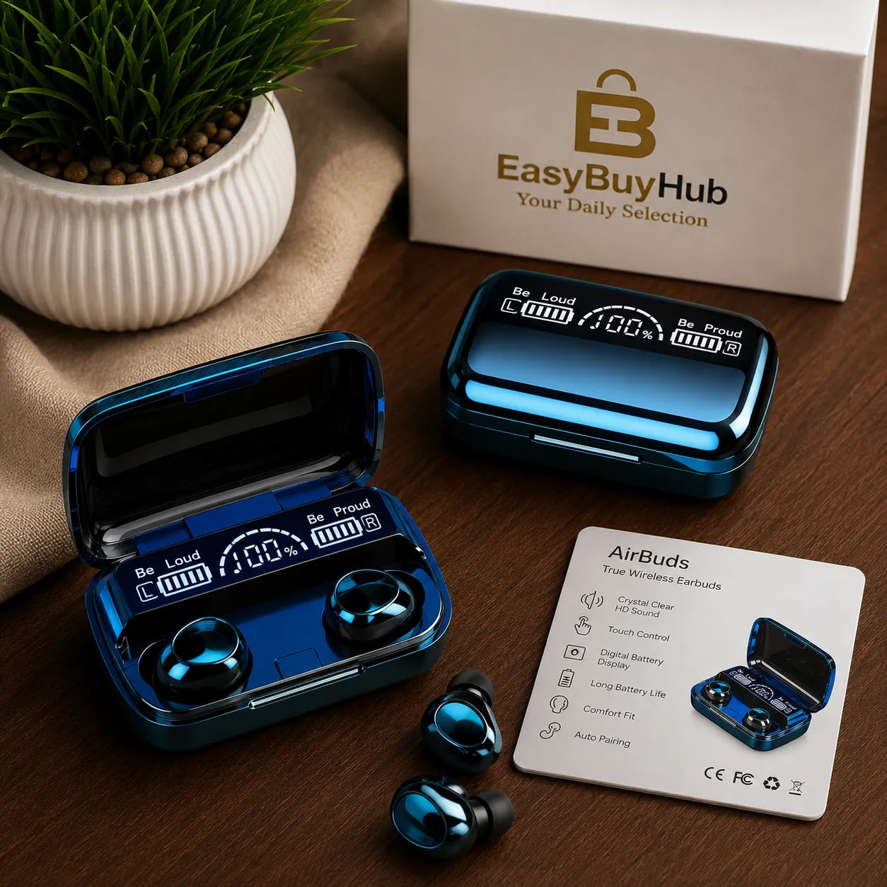 Blue metallic wireless earbuds and their charging cases arranged on a wooden surface, with an open case showing the earbuds inside, a closed case, a product box labeled EasyBuyHub, and an AirBuds instruction card.